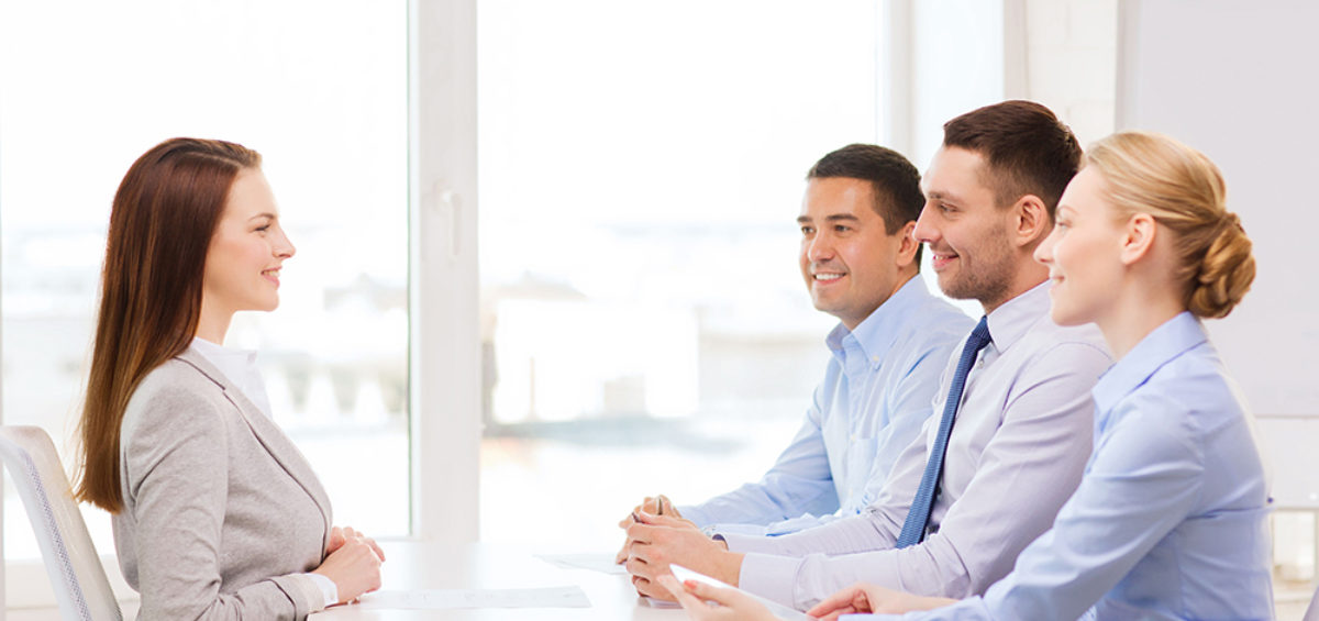 smiling businesswoman at interview in office